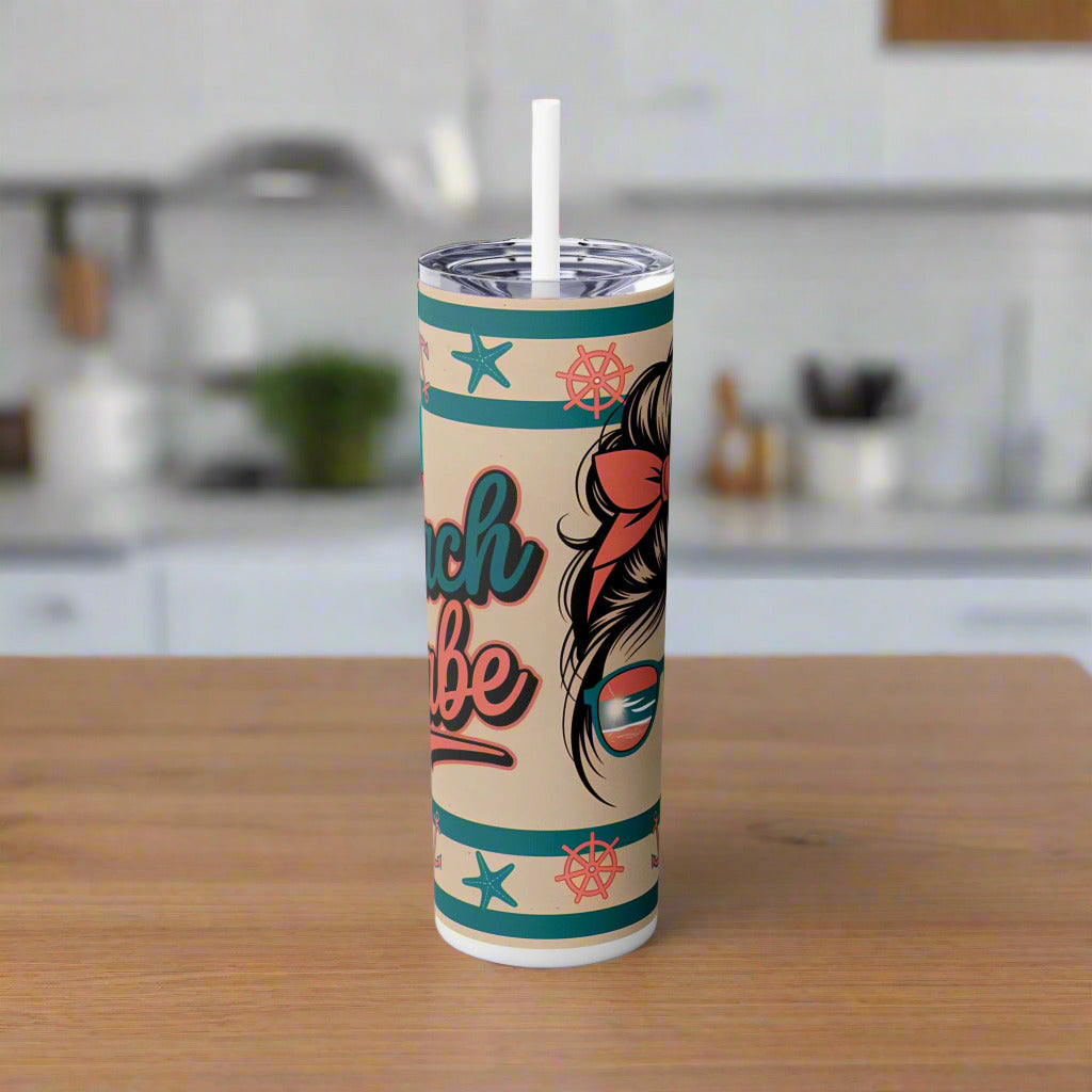 Tumbler with beach-themed design on a white background