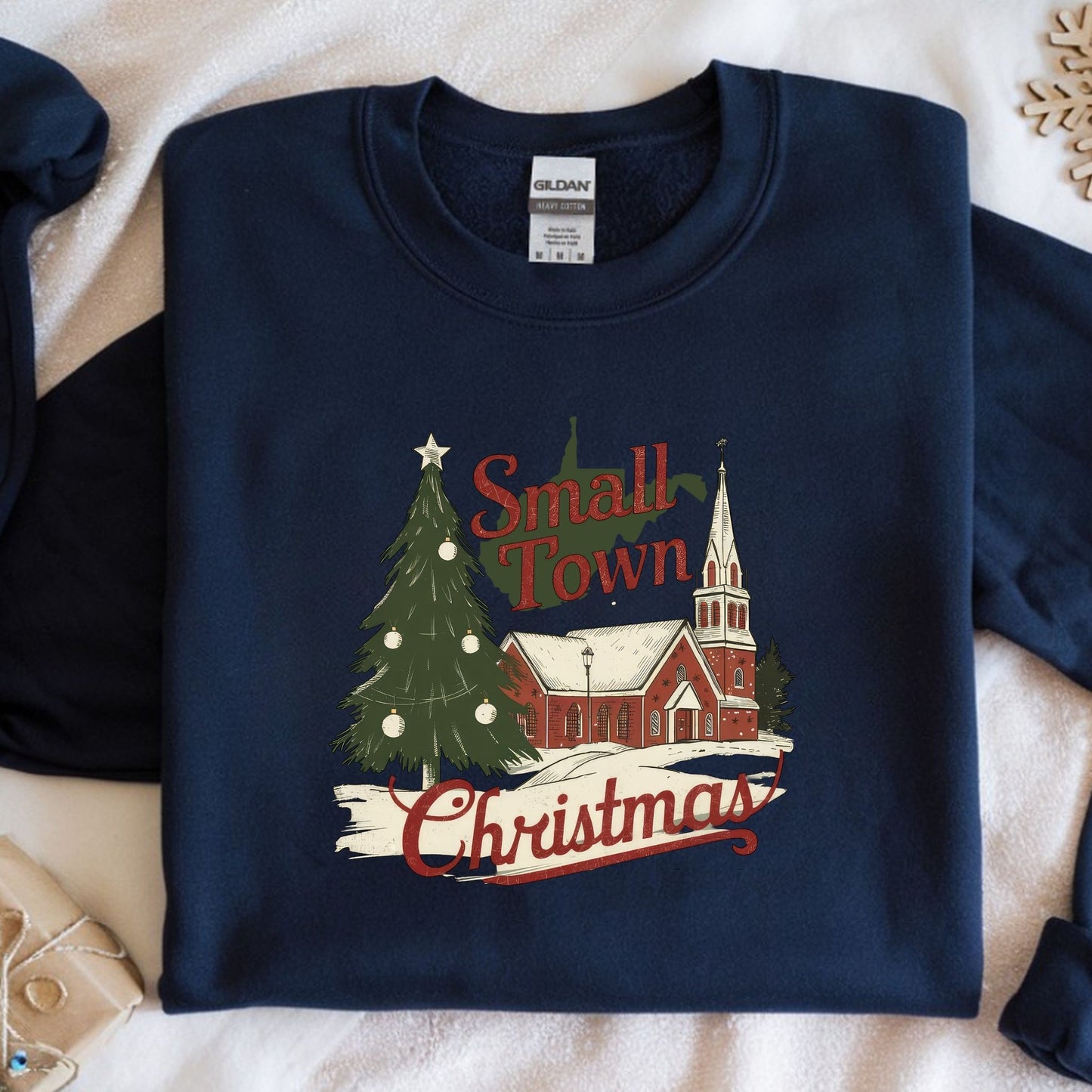 Navy blue sweatshirt with 'Small Town Christmas' design featuring a church and tree.