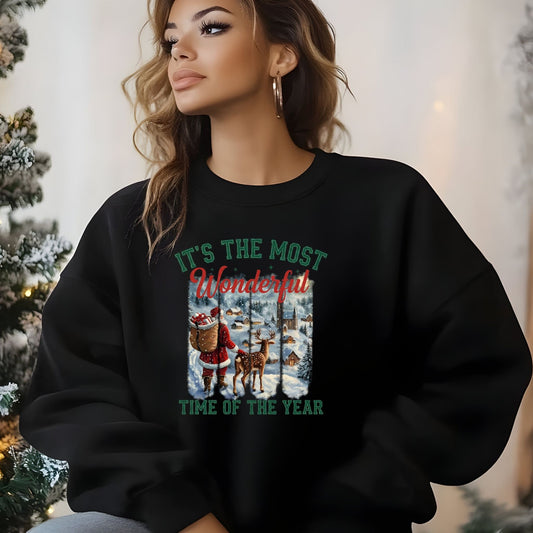 Person wearing a black Christmas-themed sweatshirt with festive design and text.