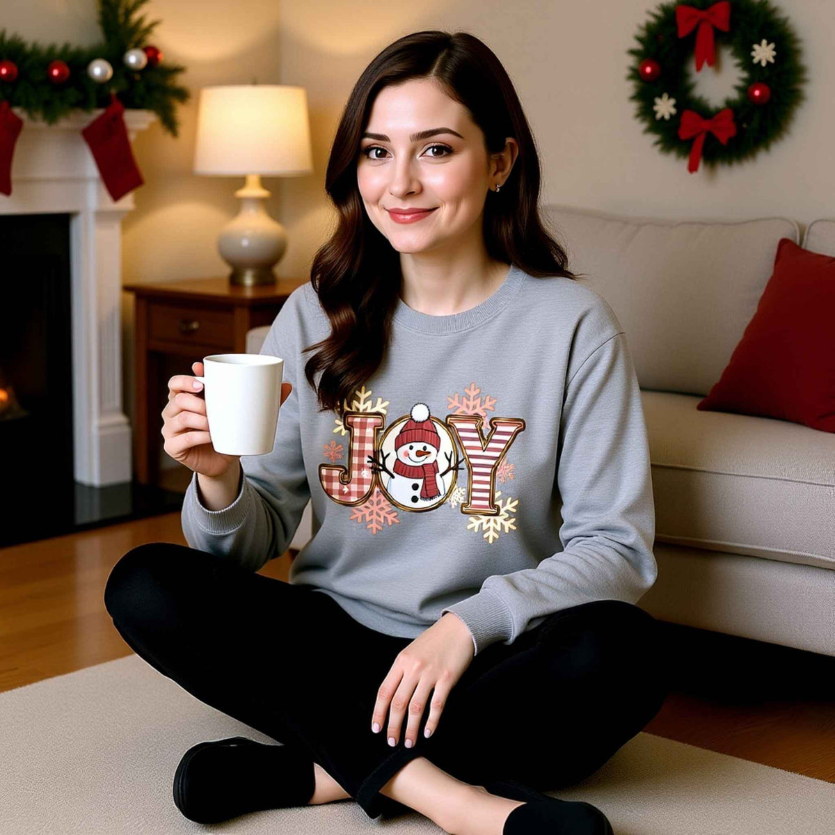 Woman wearing plaid “JOY” Snowman Christmas Crewneck Sweatshirt