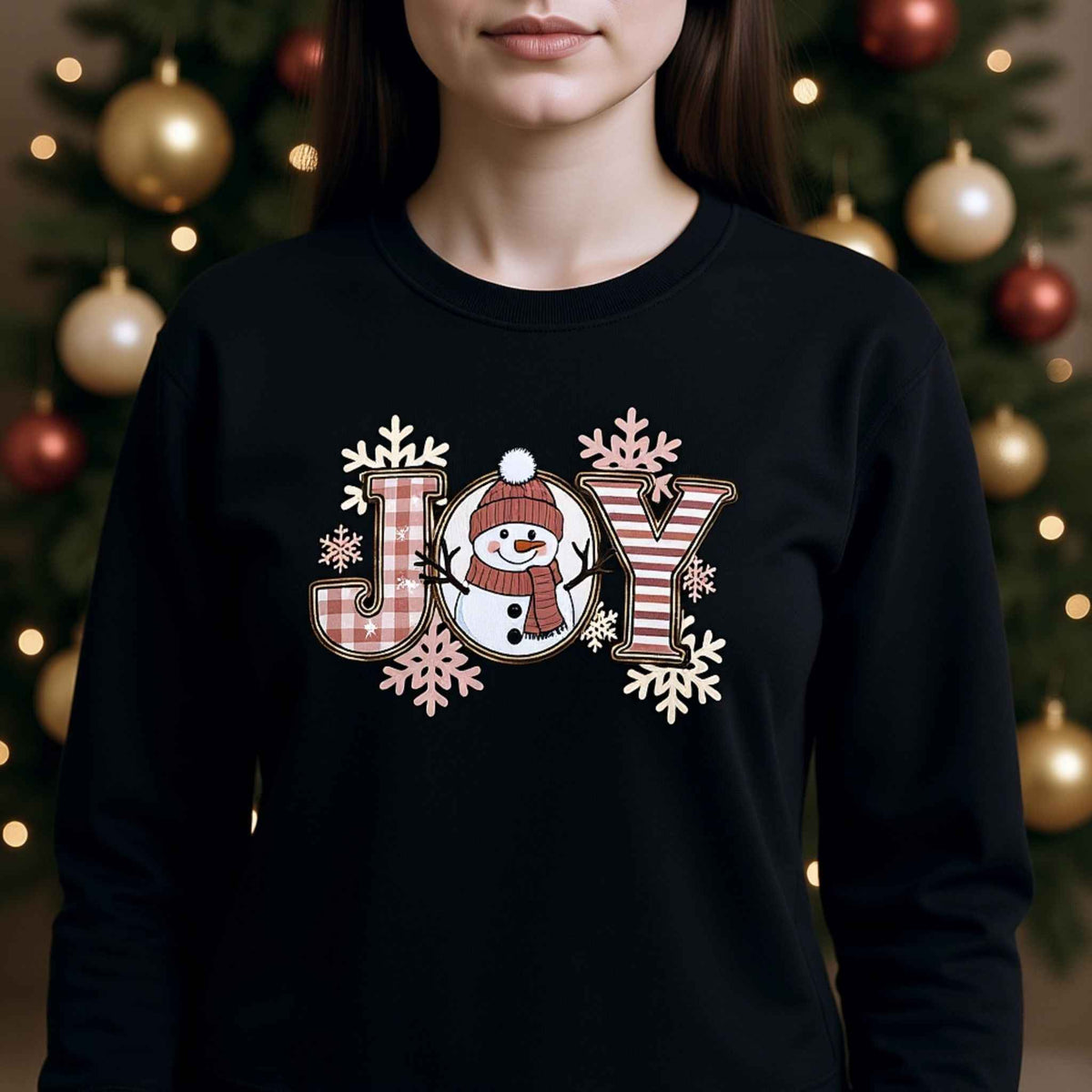 Woman wearing plaid “JOY” Snowman Christmas Crewneck Sweatshirt