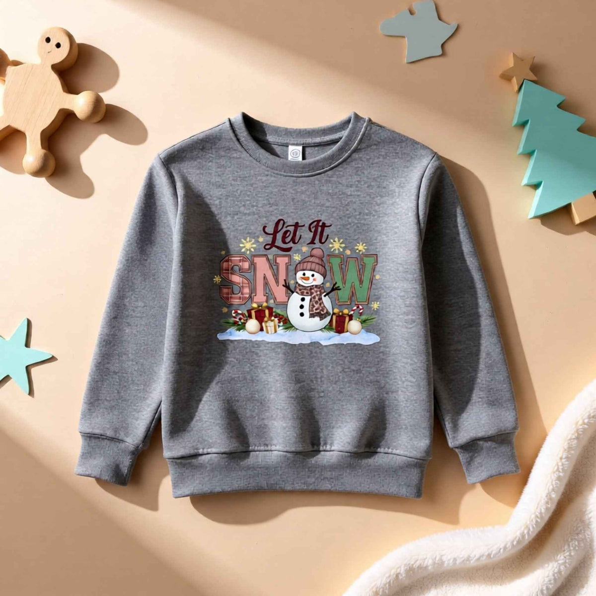 Flat lay of “Let It Snow” Snowman Toddler Christmas Crewneck