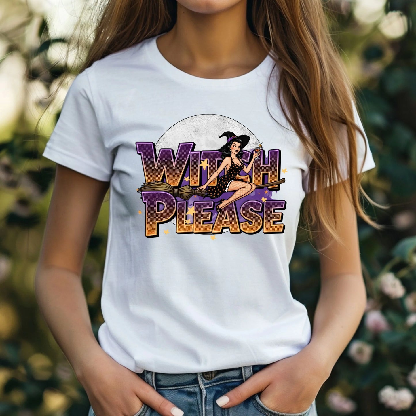 Person wearing a white t-shirt with a witch-themed graphic and text.