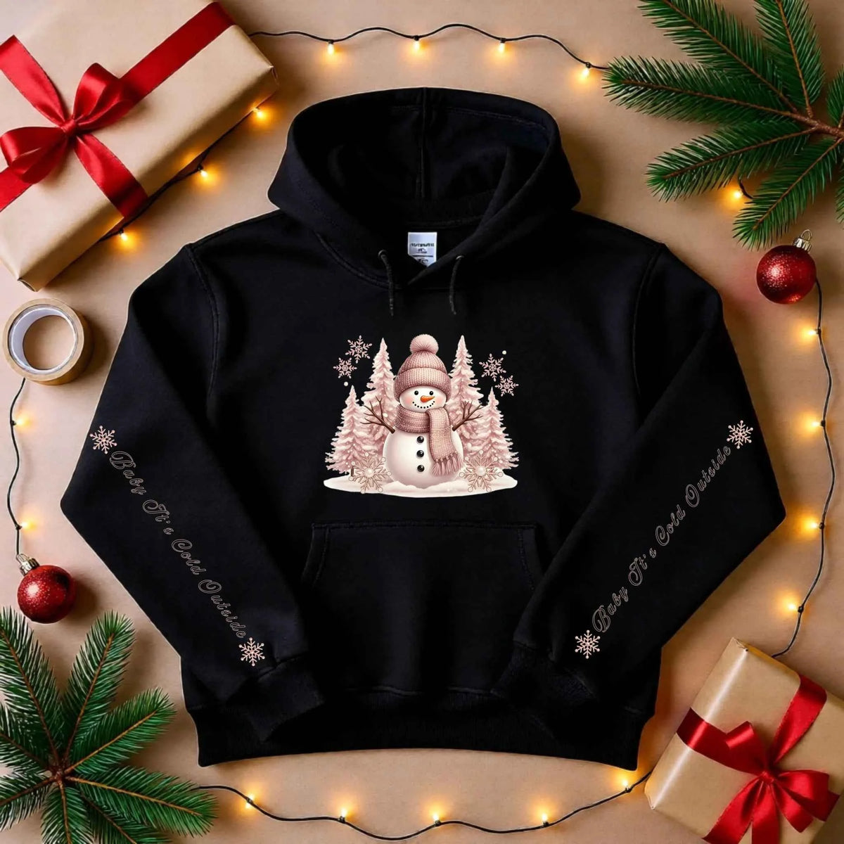 Flat lay of Snowman Winter Collection “Baby It’s Cold Outside” sleeve text design. Cozy Christmas Crewneck Sweatshirt