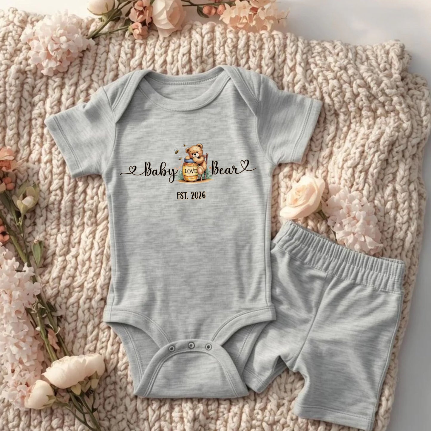 Flat lay of baby bear infant bodysuit with honey bear design from the matching family collection.
