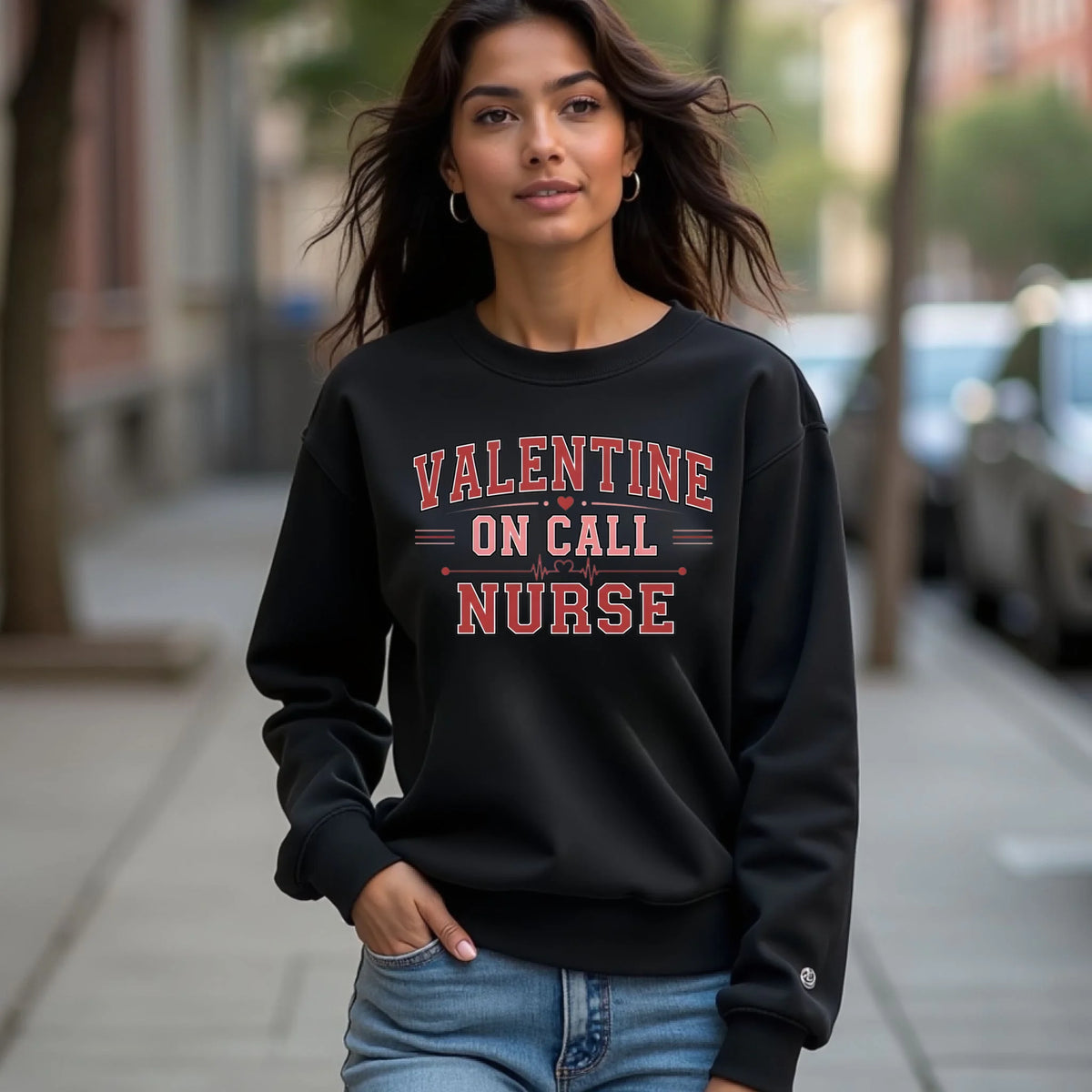 Model wearing a black Valentine On Call Nurse crewneck sweatshirt while walking outdoors, featuring a cozy unisex fit.