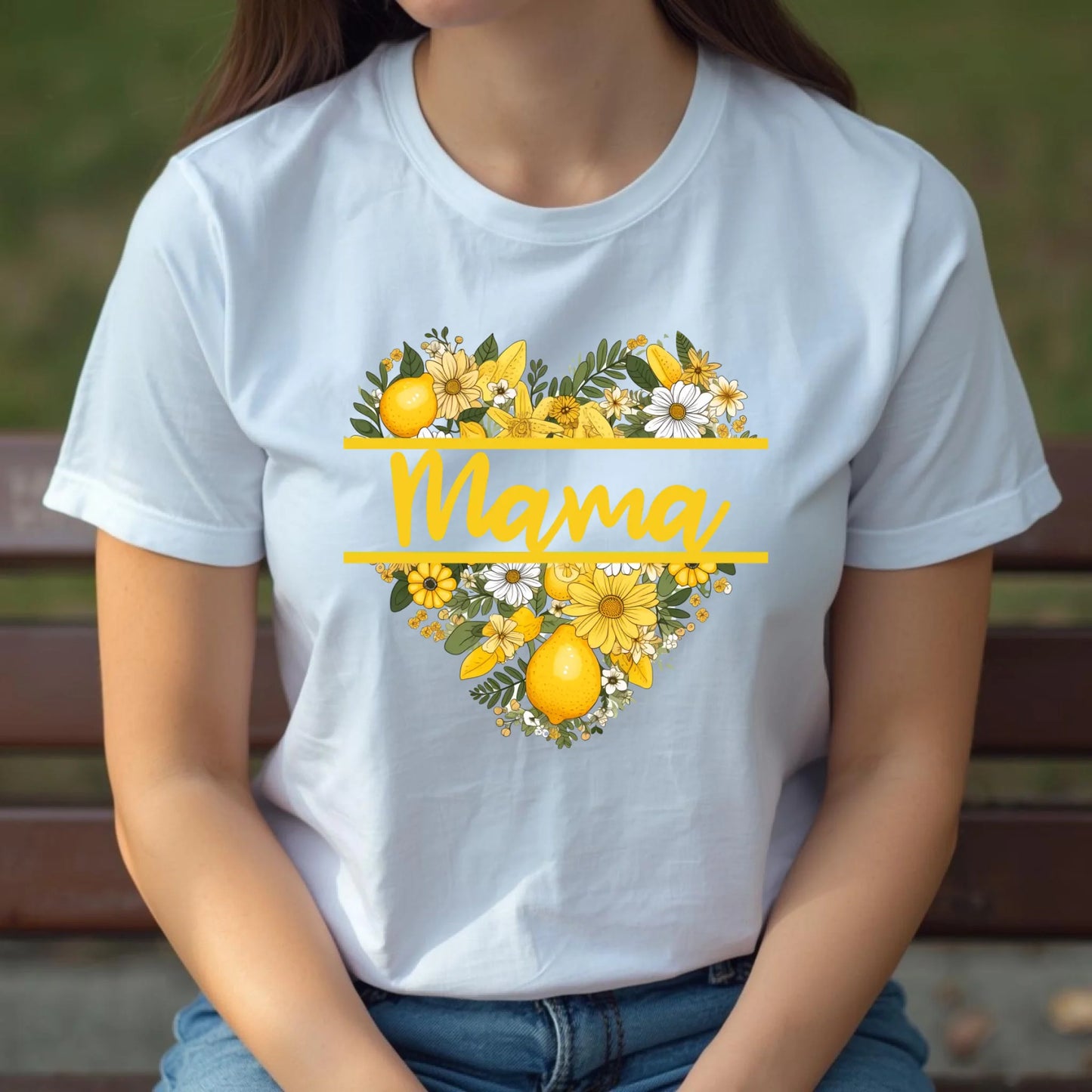 White lemon floral mama shirt shown in a relaxed seated pose, featuring a cheerful yellow floral heart design.