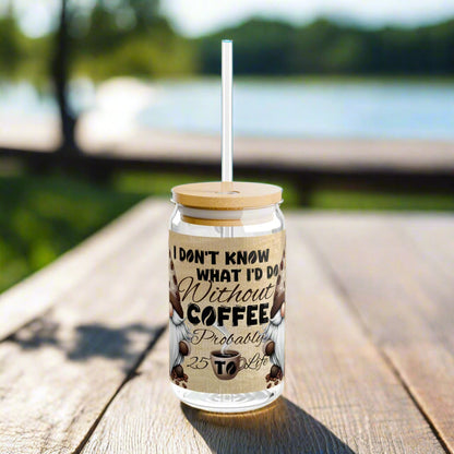 Glass tumbler with wooden lid and straw, featuring a coffee-themed design and text.