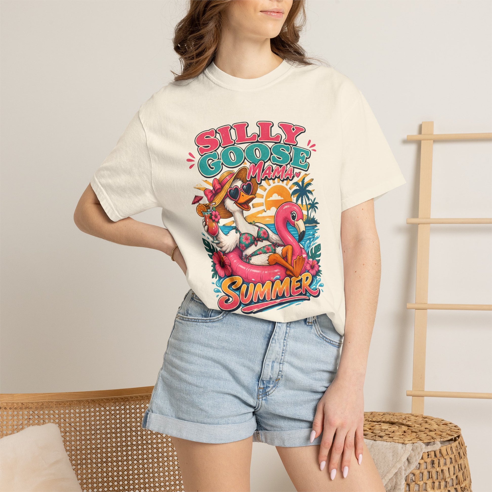 Woman wearing a ivory comfort colors tshirt with a silly goose mama summer graphic design