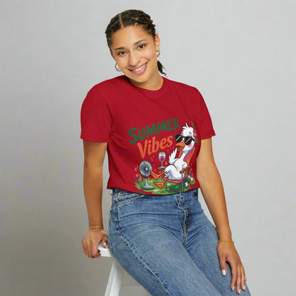Person wearing a red 'Summer Vibes' t-shirt with a cartoon character on a white background