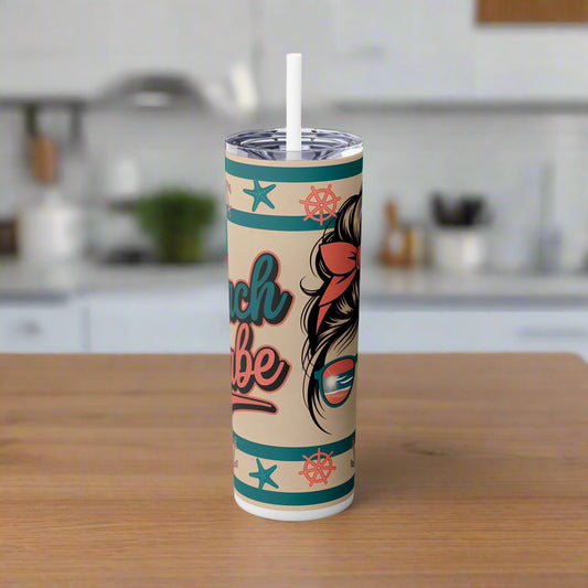 Tumbler with beach-themed design on a white background