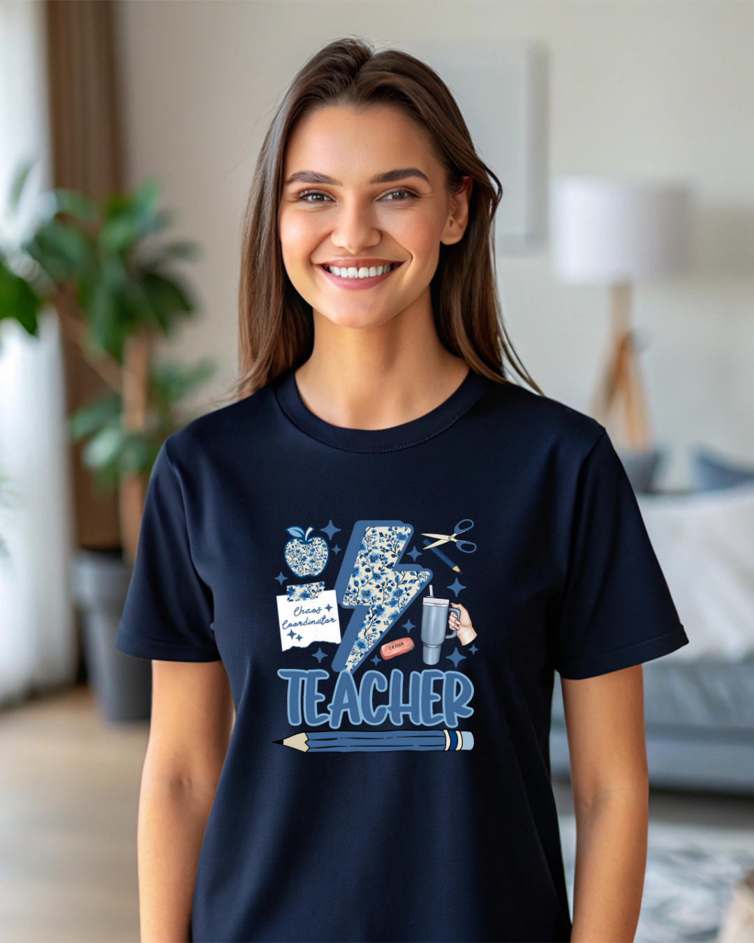 Woman wearing a navy blue t-shirt with a 'Teacher' graphic design in a room.