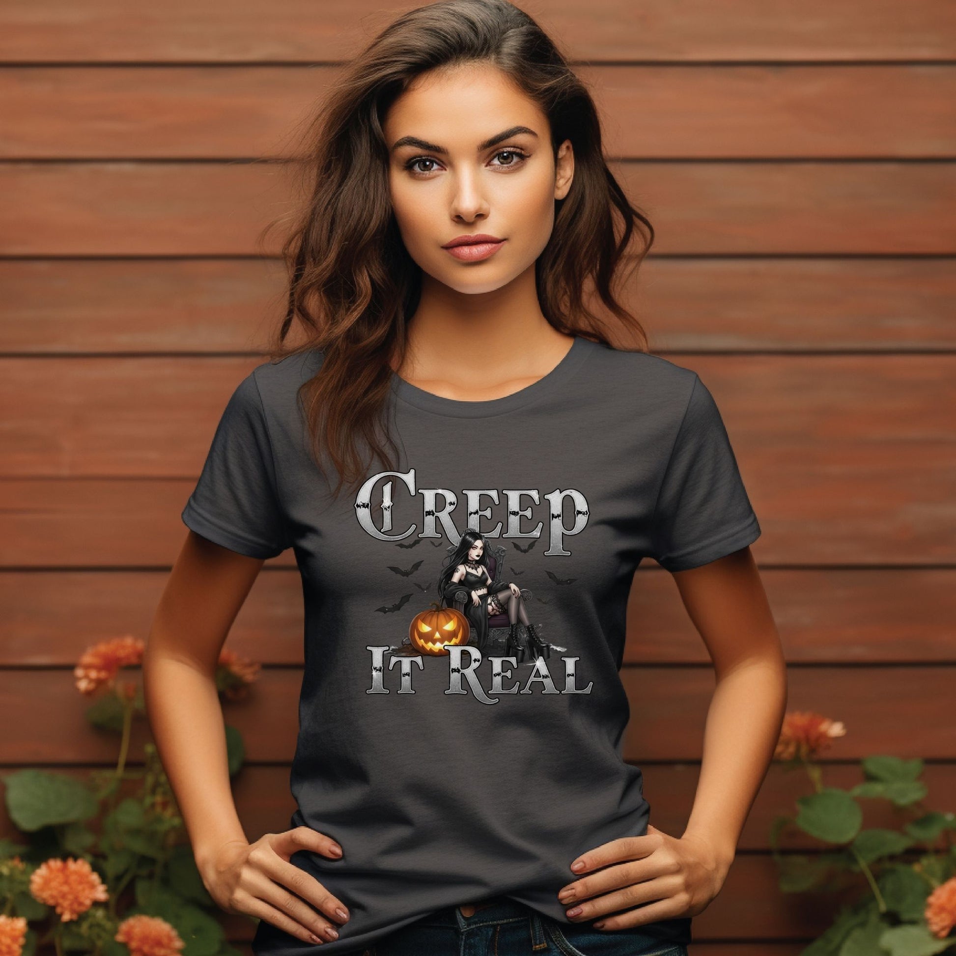 Woman wearing a dark gray t-shirt with a Halloween-themed graphic and text.