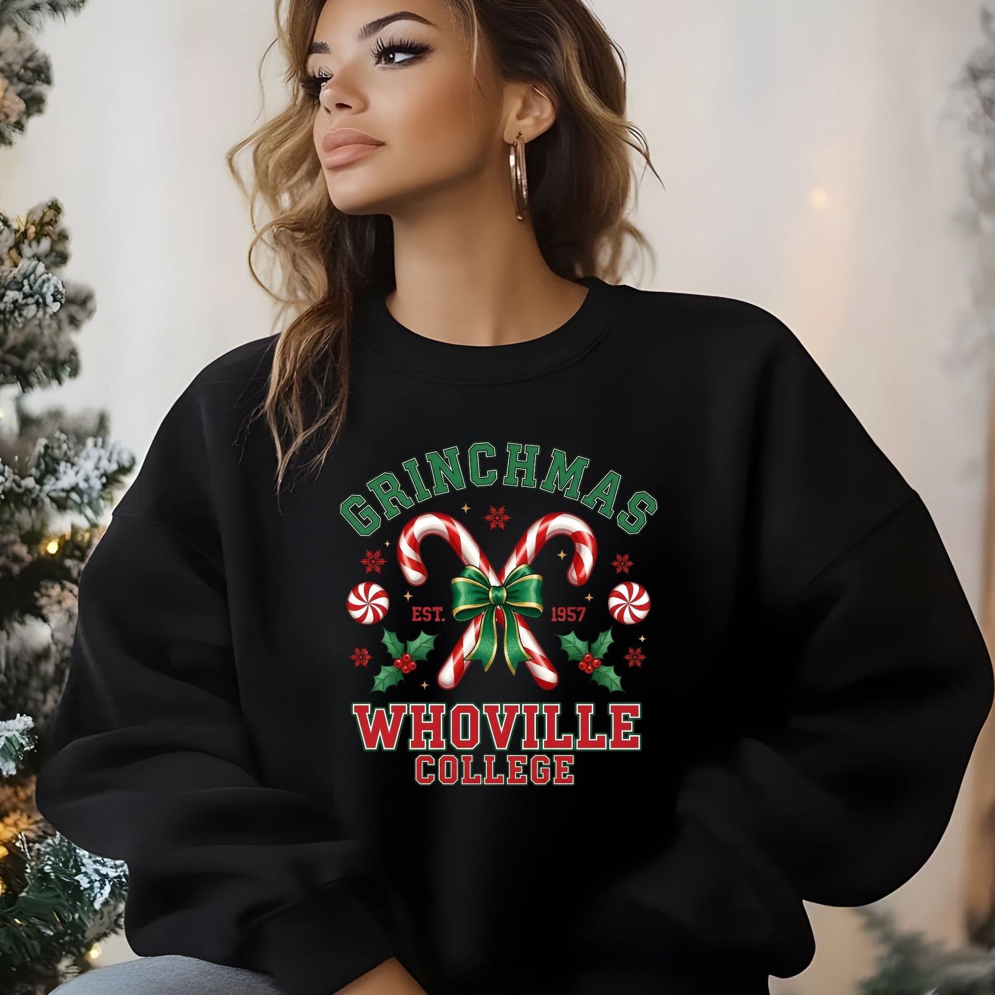 Person wearing a black sweatshirt with 'Grinchmas Whoville College' design in a festive setting.