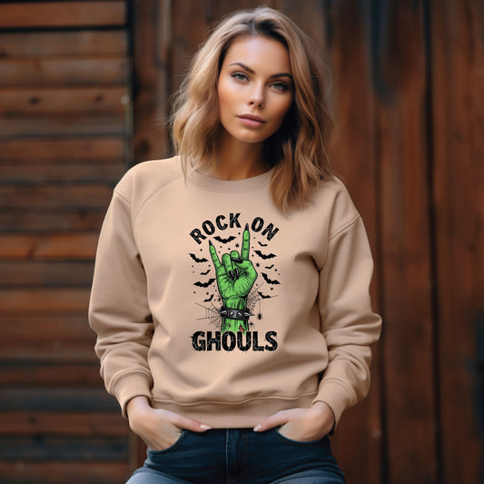 Woman wearing a beige sweatshirt with a green hand gesture and text against a wooden background