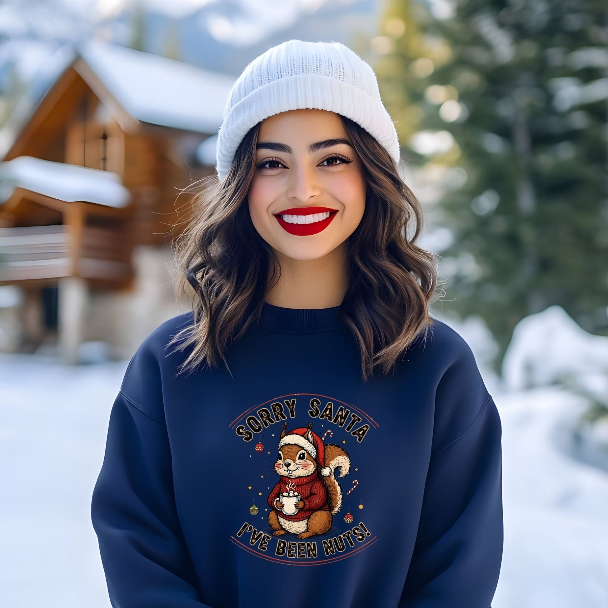 Woman wearing a navy blue sweatshirt with a Christmas design in a snowy outdoor setting