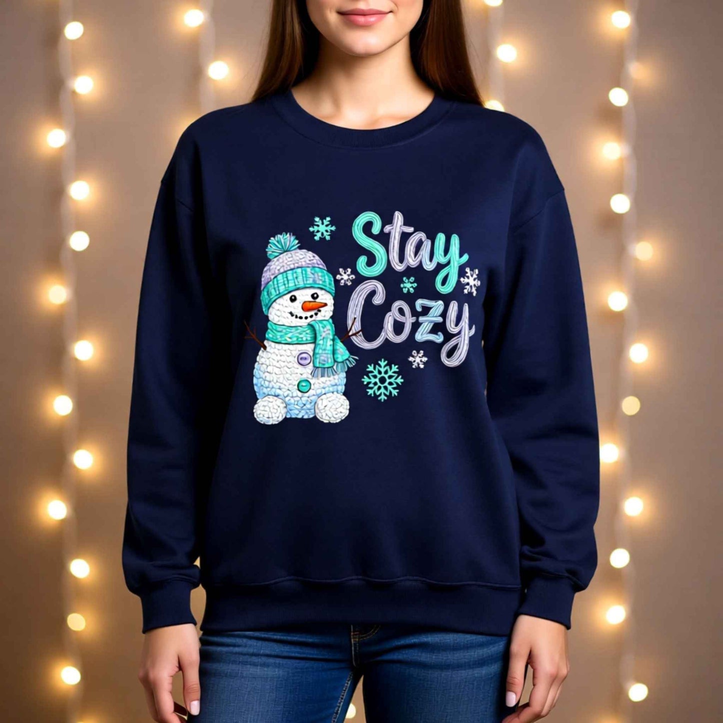 Woman wearing faux crochet knit Christmas crewneck sweatshirt with “Stay Cozy” snowman winter design
