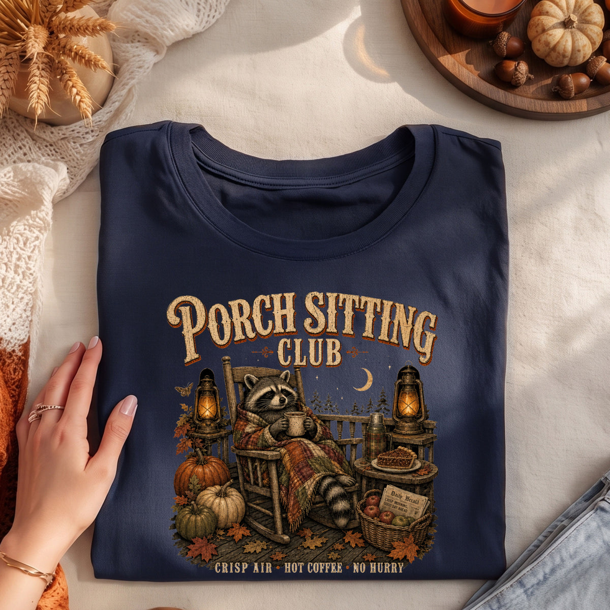 Porch Sitting Club cozy fall raccoon graphic T-shirt