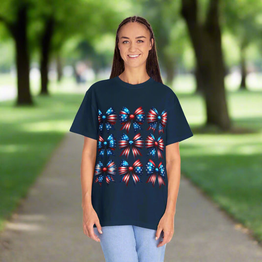 Person wearing a navy blue t-shirt with colorful bow design on a white background