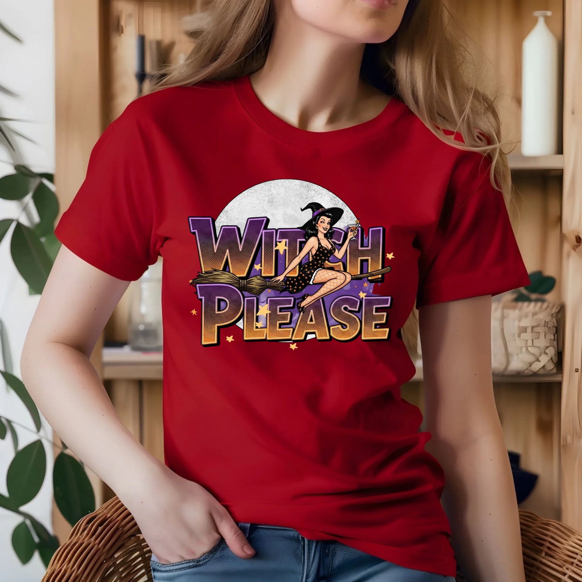 Person wearing a red t-shirt with 'Witch Please' graphic design.