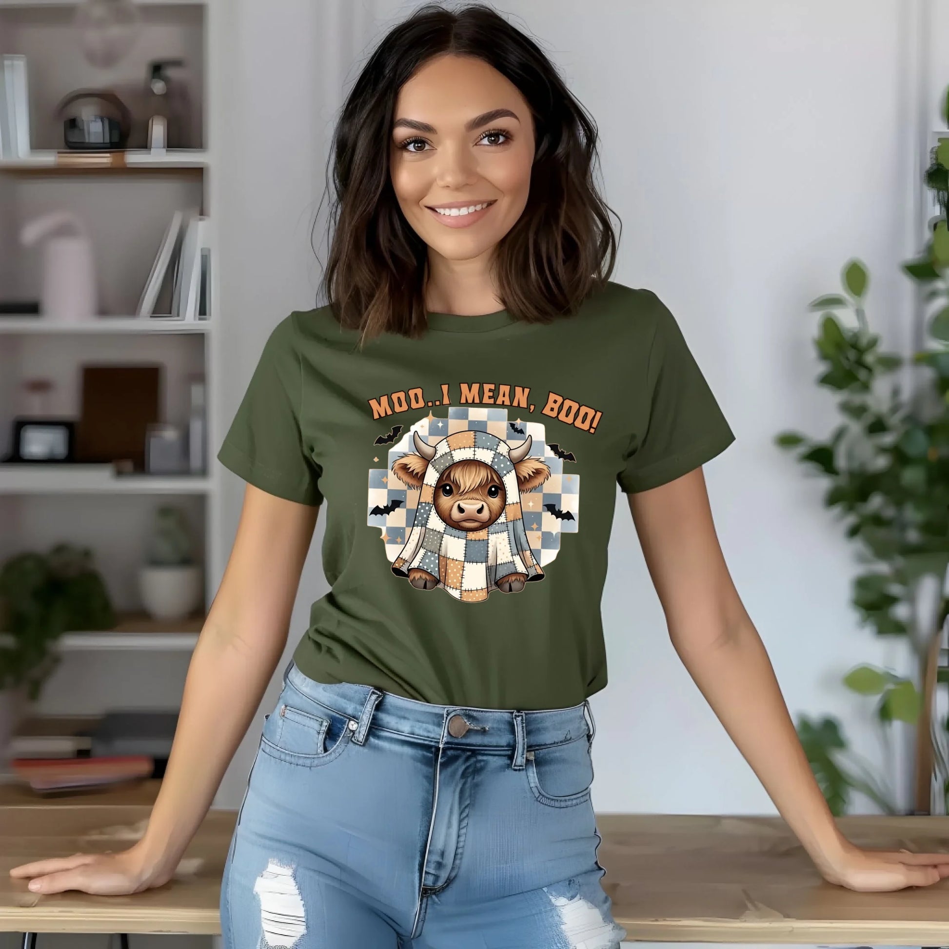 Woman wearing a green t-shirt with a graphic design and text, standing in an indoor setting.