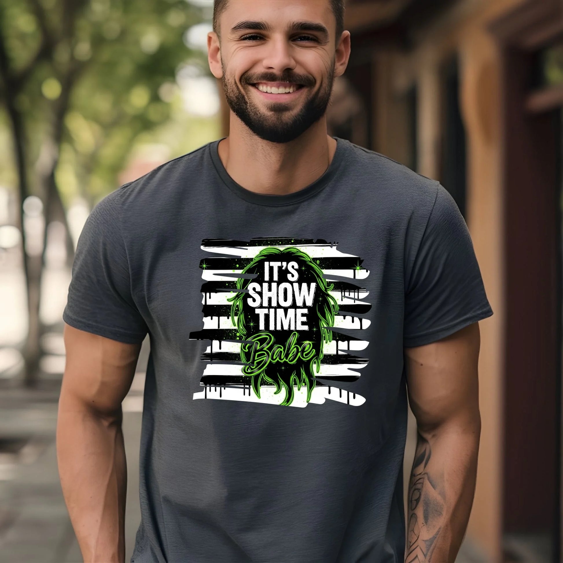 Man wearing a dark gray t-shirt with a graphic design and text outdoors.