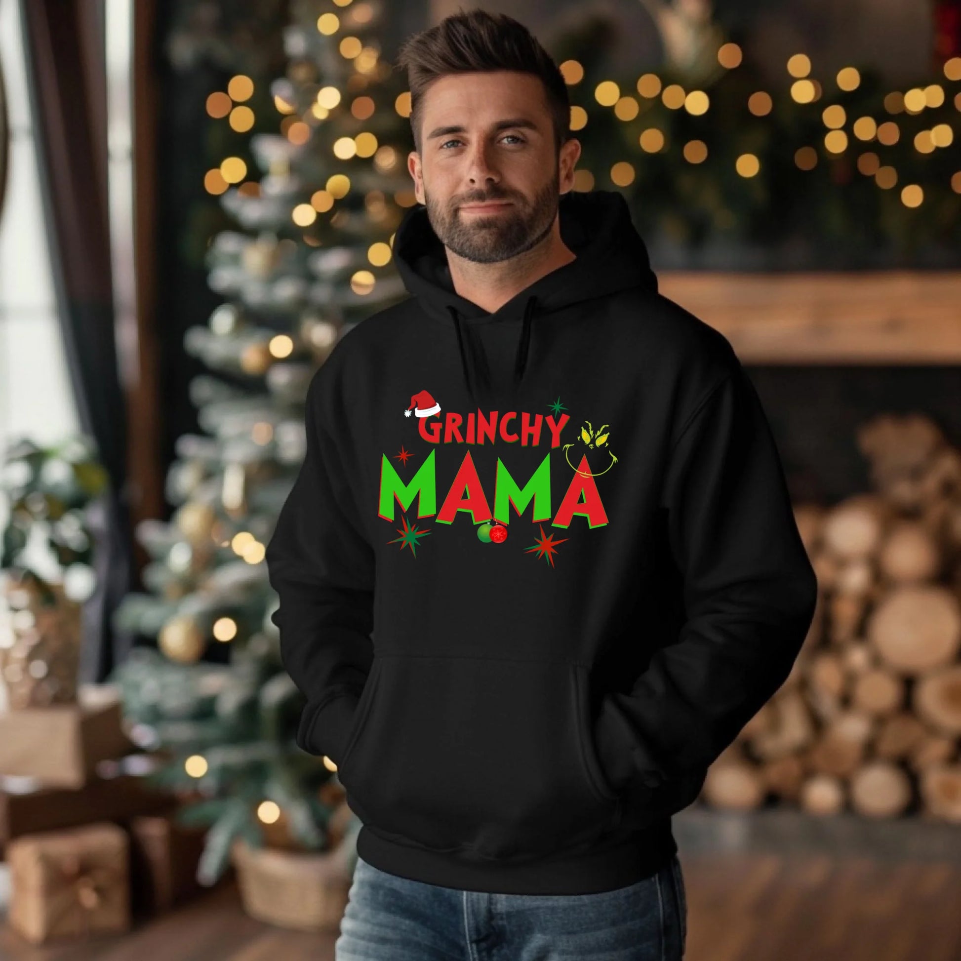 Man wearing a black hoodie with 'Grinchy Mama' text in a festive setting.