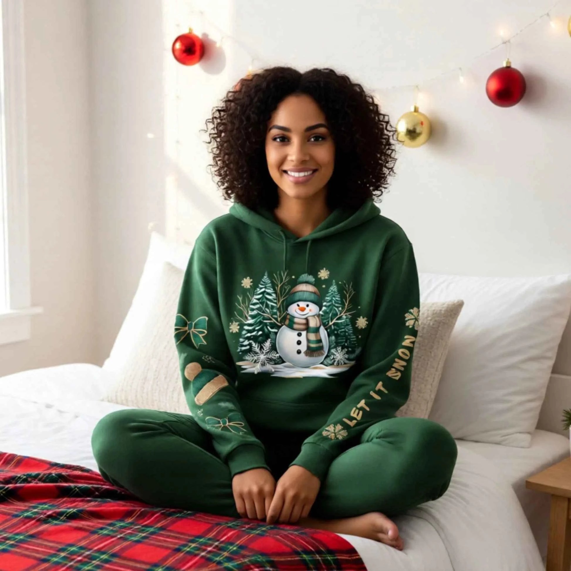 Woman wearing a Snowman Winter Collection “Let It Snow” sleeve text design. Cozy Christmas Crewneck Sweatshirt