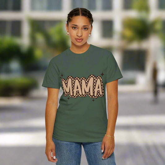 Person wearing a green t-shirt with 'MAMA' printed on it against a white background