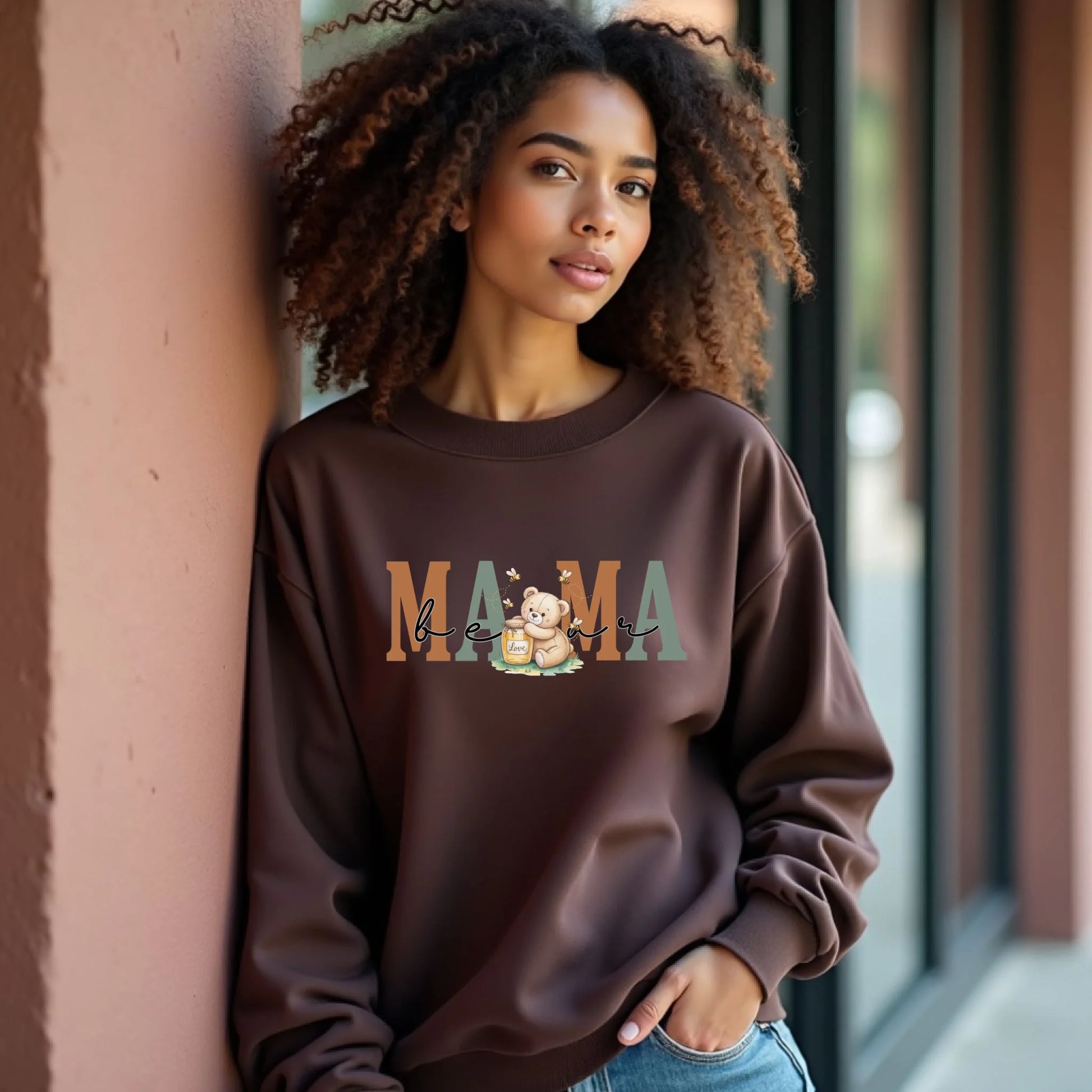 Model styled in a brown crewneck sweatshirt showcasing the personalized mama honey bear design for everyday wear.