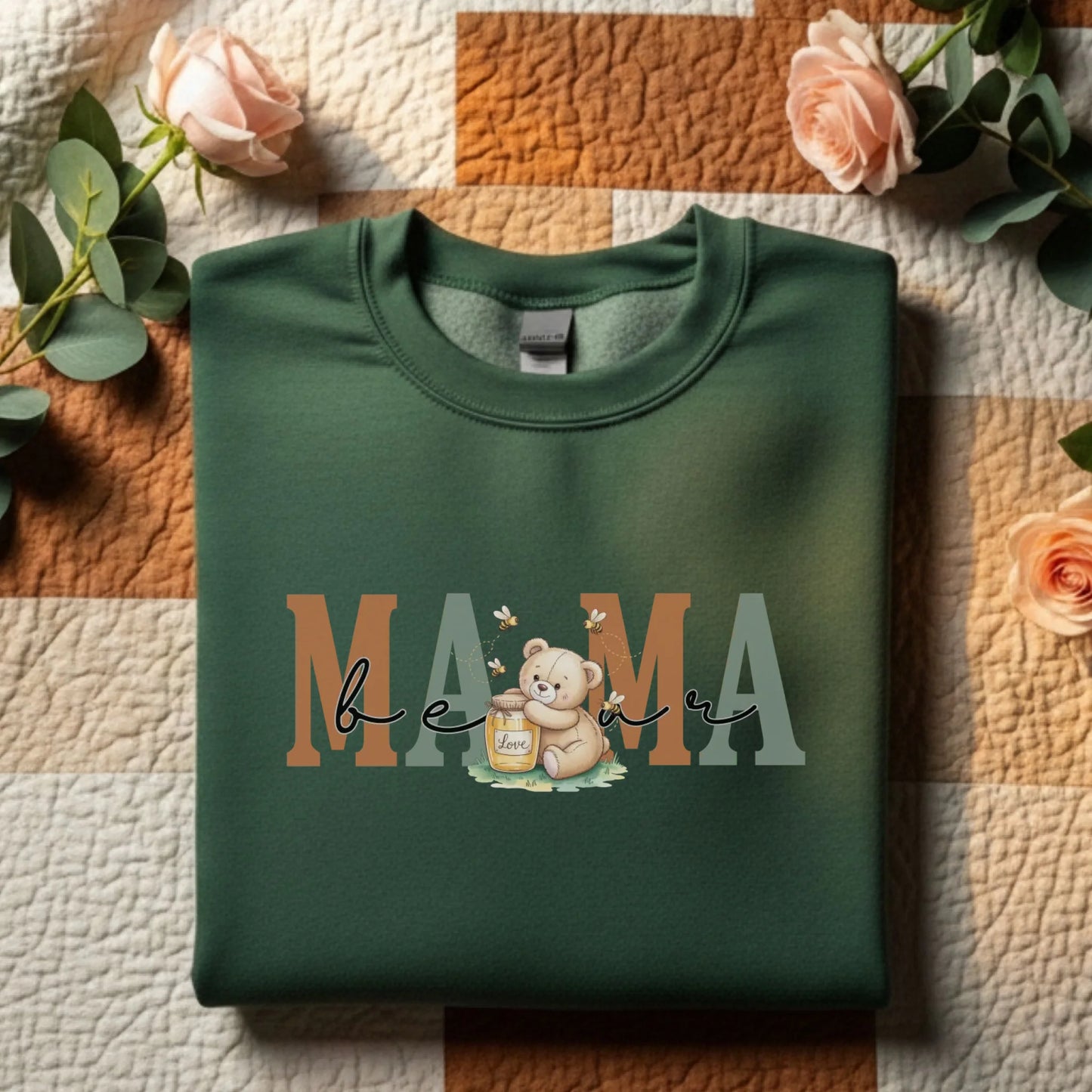 Green Gildan crewneck displayed flat with decorative accents, featuring the mama family role honey bear design.