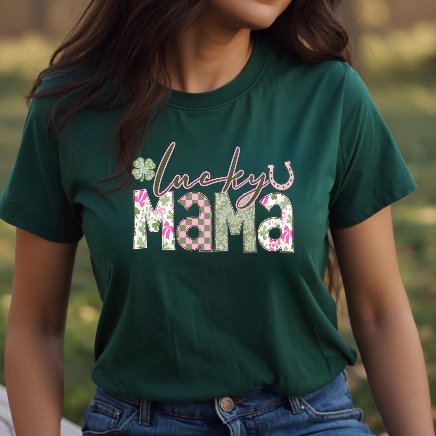 Person wearing a green t-shirt with 'Lucky Mama' text in a floral design.