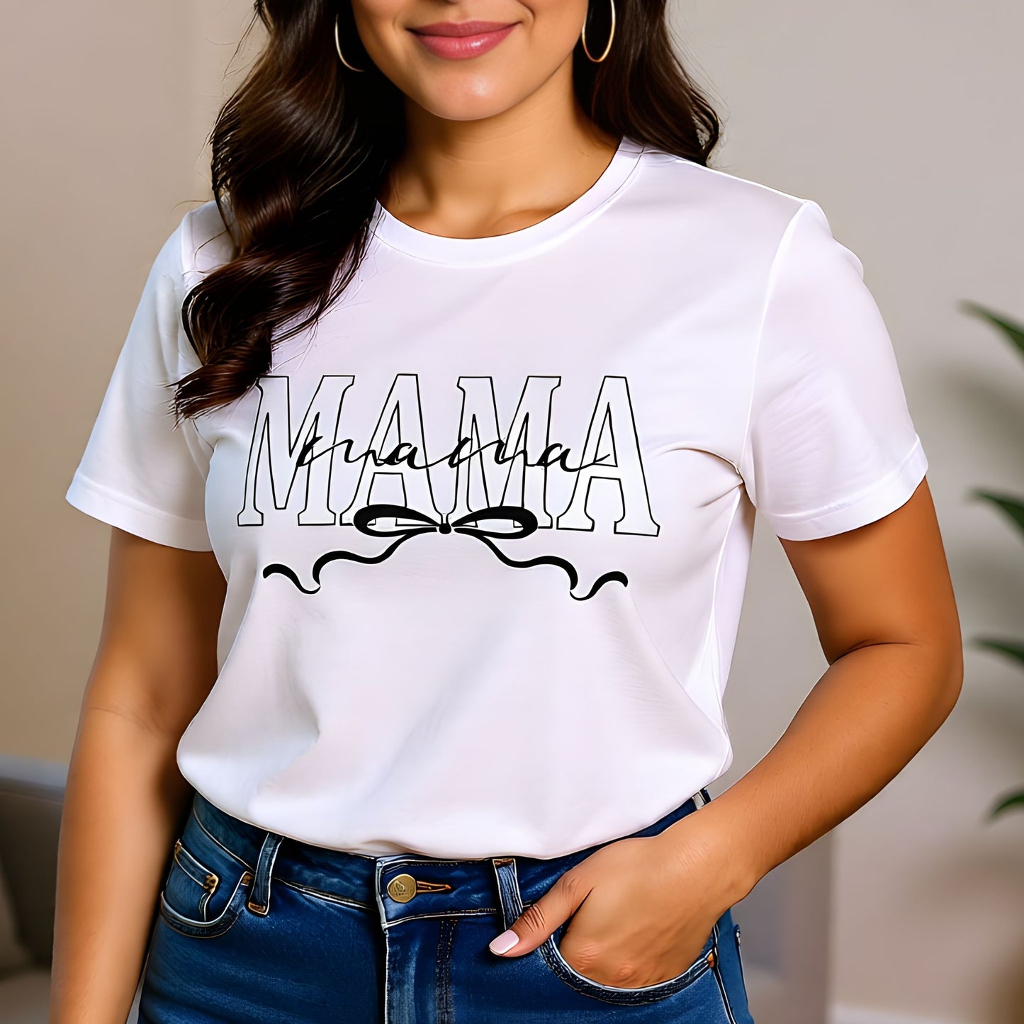 Woman wearing a white Mama bow script t-shirt styled casually, highlighting a clean minimalist Mother’s Day look.