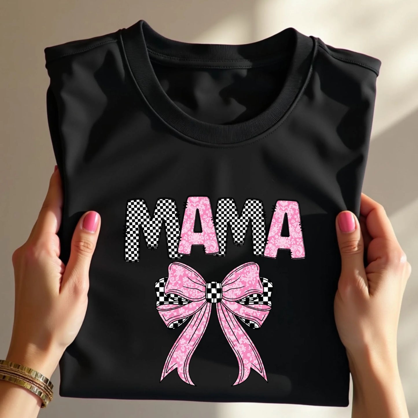 Flat lay of Mama checkered bow t-shirt folded neatly, modern mom graphic tee gift idea
