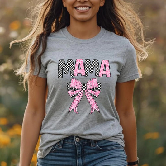 Woman wearing Mama checkered bow graphic t-shirt in a casual outdoor setting, trendy Mother’s Day shirt for moms