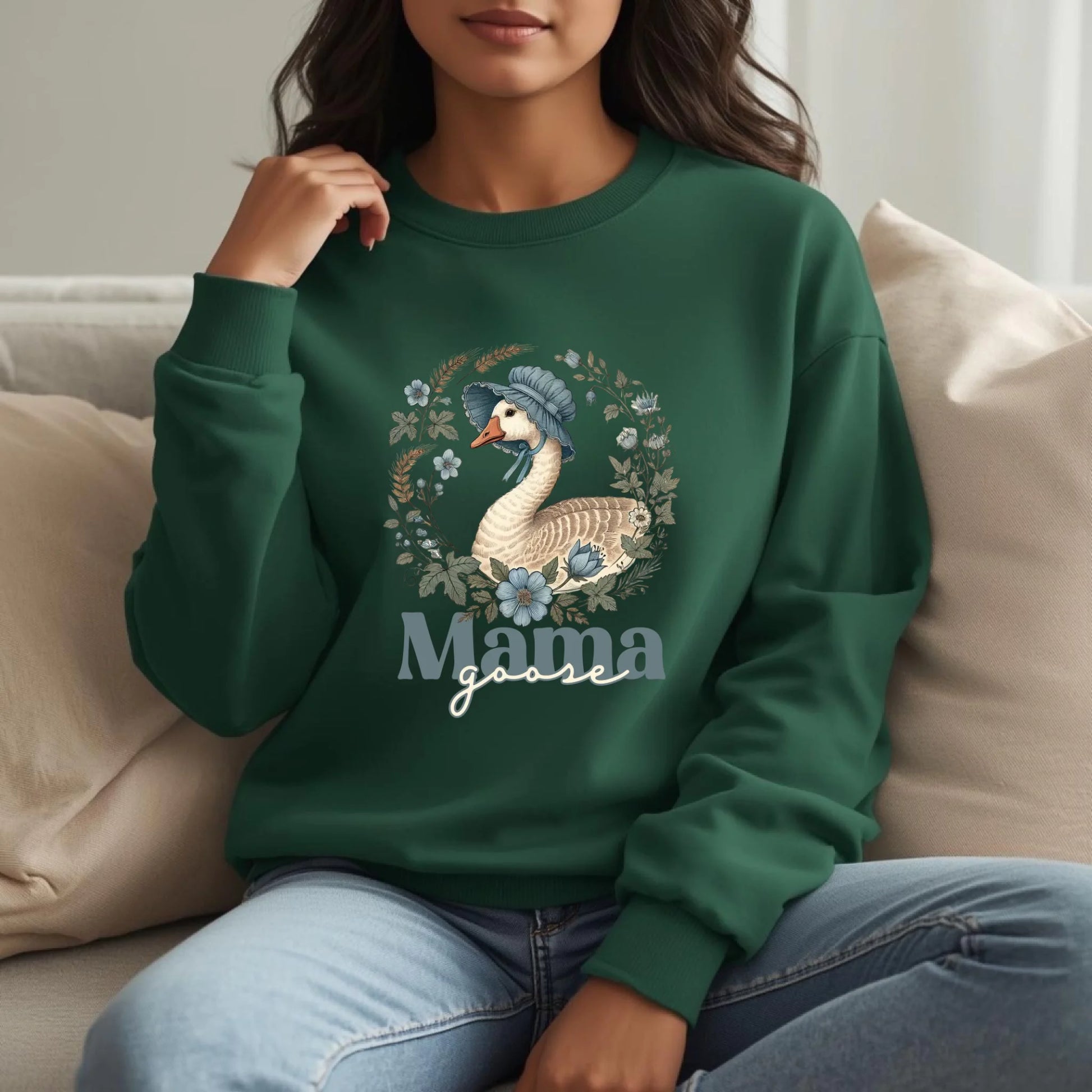 Woman wearing a forest green Mama Goose floral crewneck sweatshirt outdoors, styled casually with a soft vintage goose design.