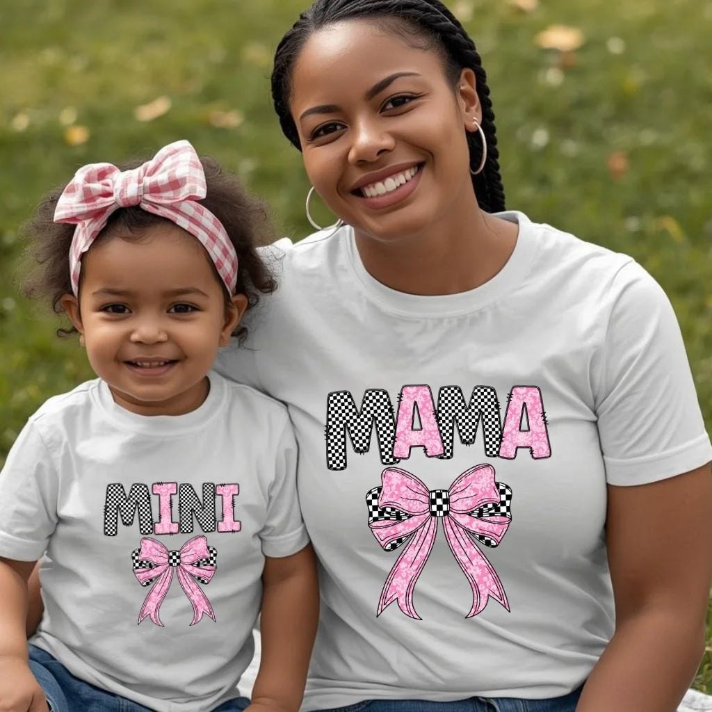 Mother and toddler wearing matching Mama and Mini checkered bow shirts outdoors, stylish mommy and me outfits for Mother’s Day and family photos