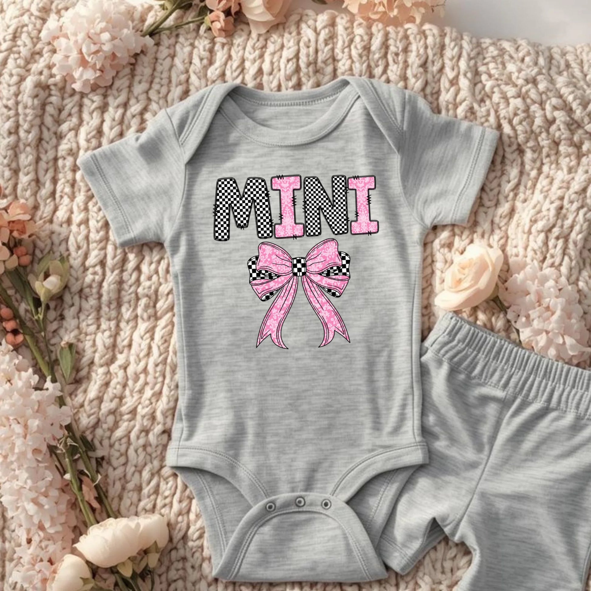 Grey Mini bow baby onesie laid flat, matching mommy and me baby outfit
