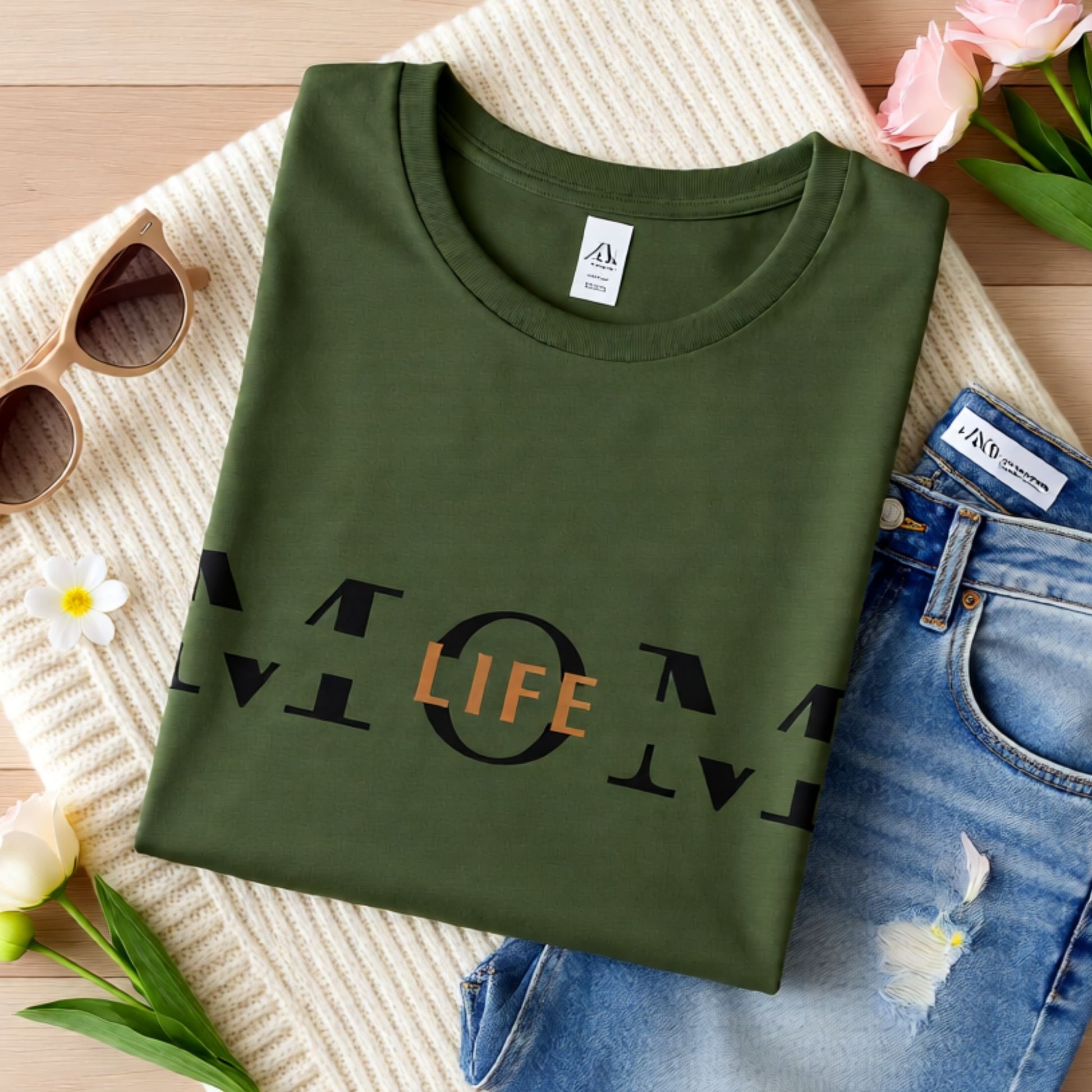 Military green Bella Canvas t-shirt featuring the Mom Life design displayed in a styled flat lay mockup.