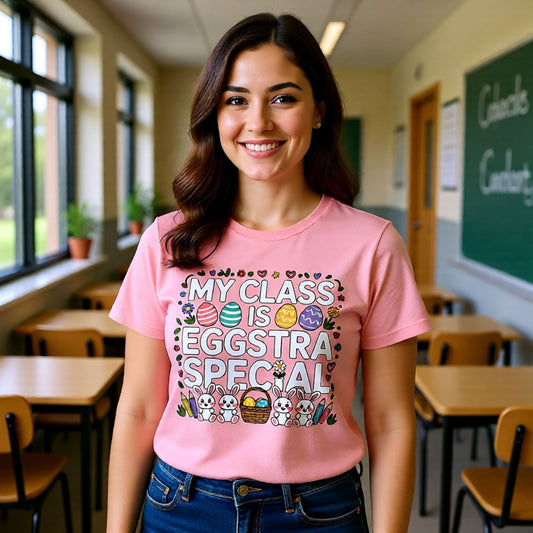 Woman wearing a pink t-shirt with Easter-themed design in a classroom setting