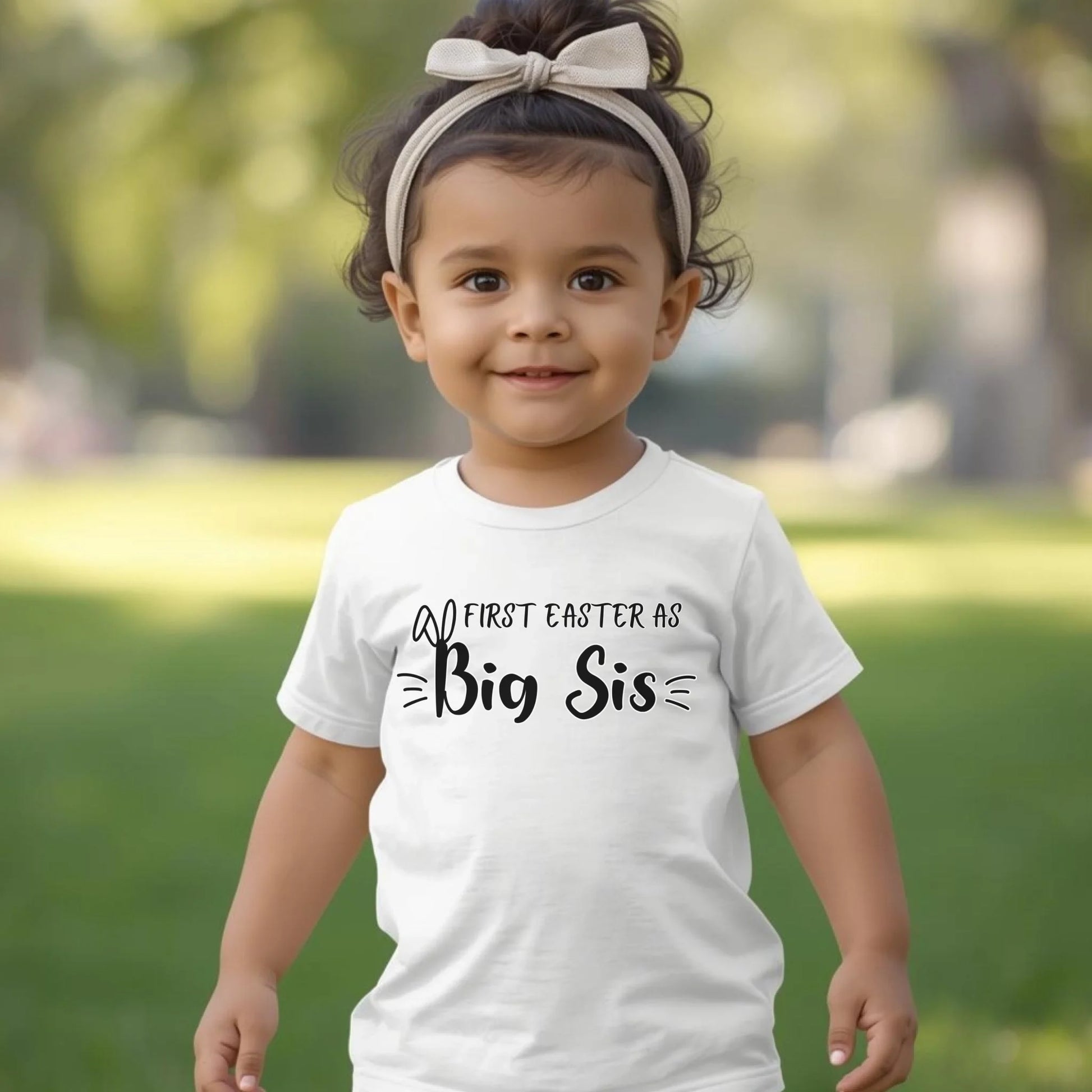 White toddler t-shirt featuring “First Easter as Big Sis” design, perfect for Easter photos and family gatherings.