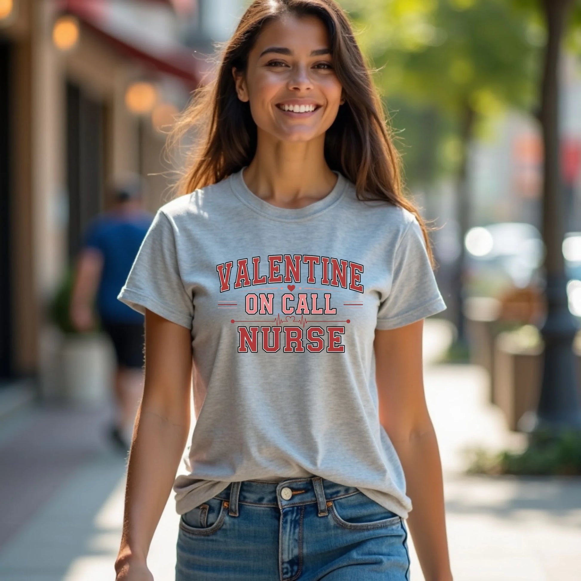 Smiling model wearing a Valentine On Call Nurse unisex t-shirt with bold lettering, perfect for Valentine’s Day and year-round wear.