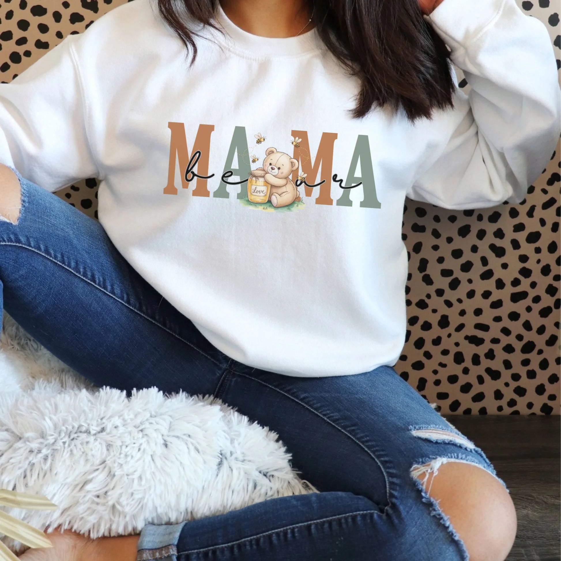 Relaxed fit white Gildan crewneck featuring the mama honey bear illustration styled for cozy casual outfits.