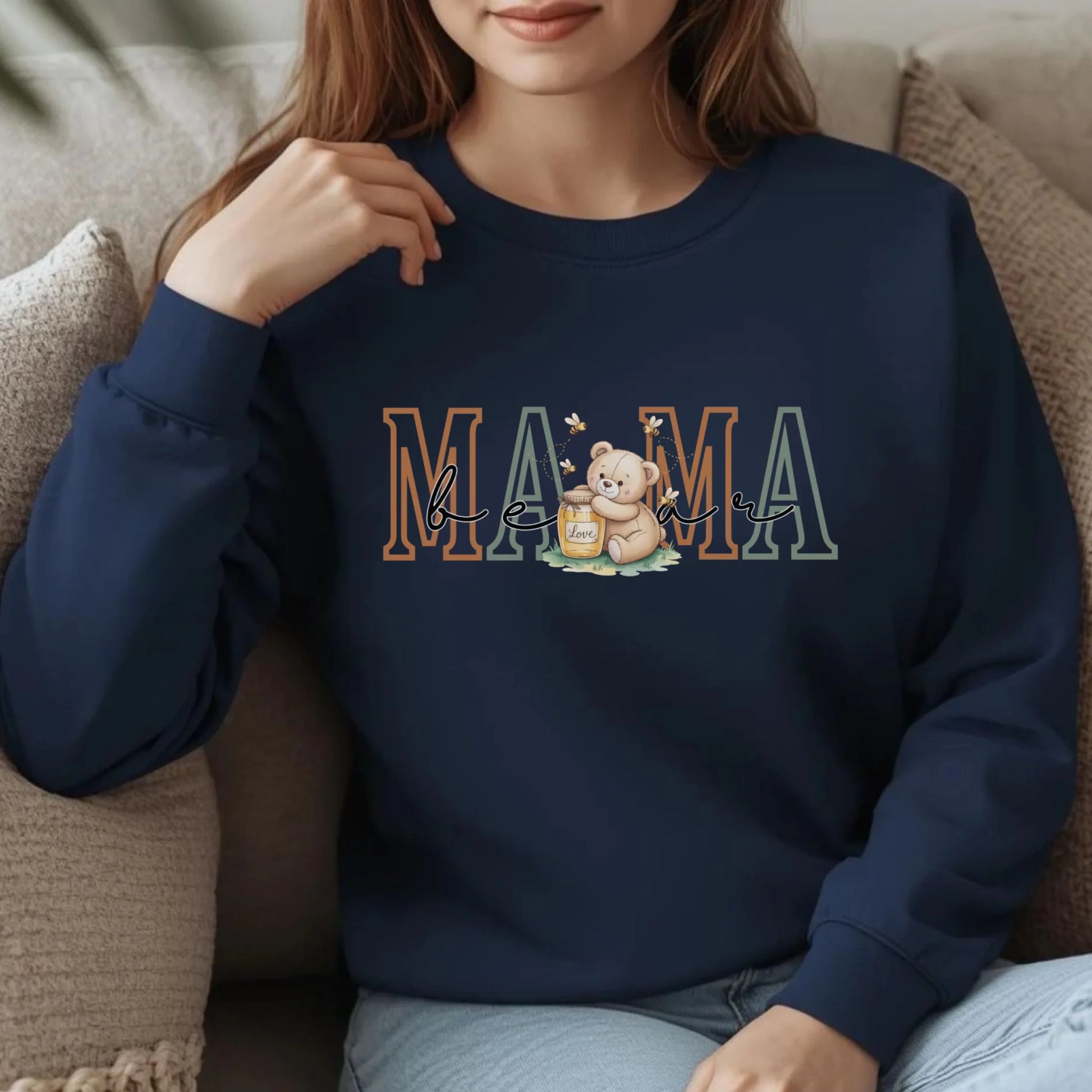 Lifestyle mockup of a woman wearing a navy personalized Mama crewneck sweatshirt featuring the teddy bear family role design on the front.