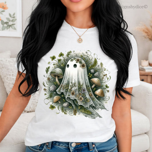 Person wearing a white t-shirt with a green ghost and mushroom design.