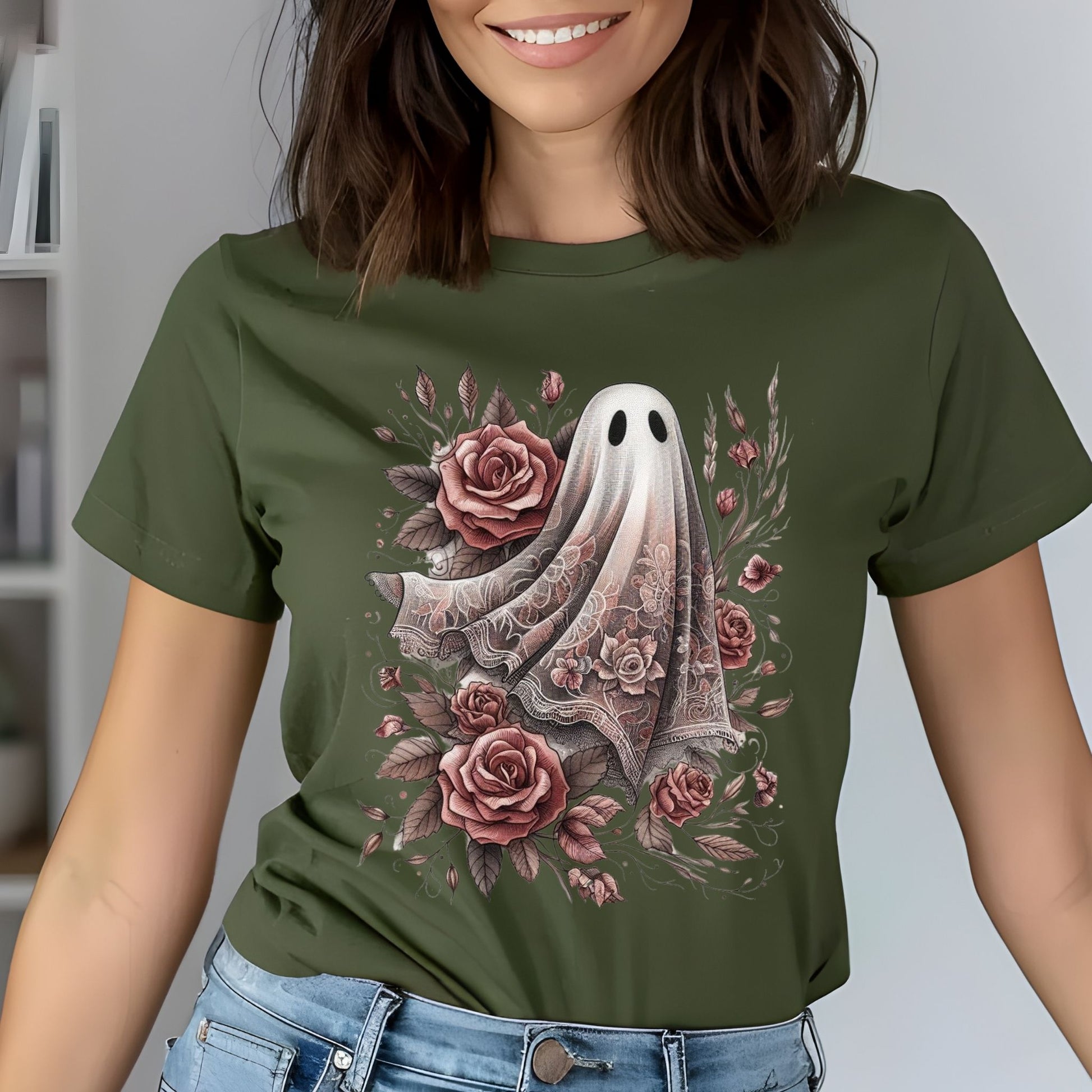 Person wearing a green t-shirt with a ghost and floral design.