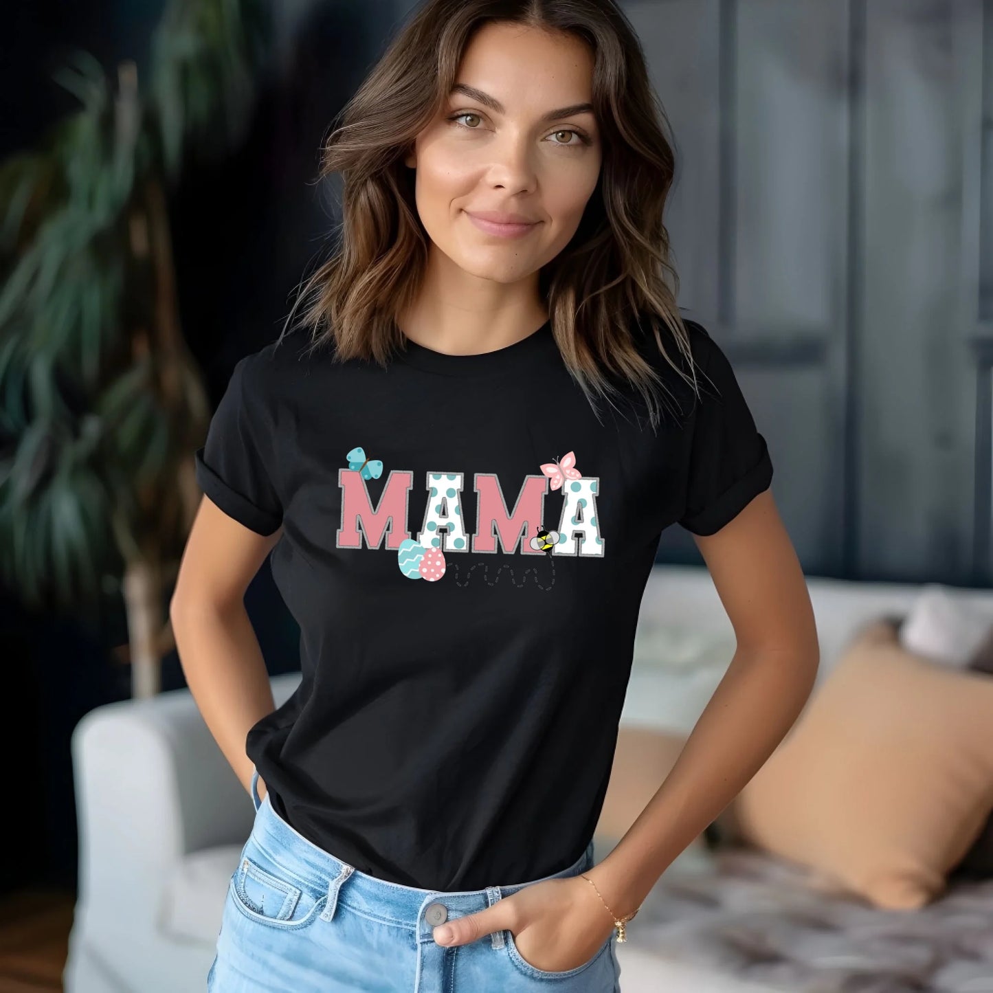Model wearing a black Bella Canvas “Mama” Easter t-shirt from a Mommy and Me matching set, photographed in a modern lifestyle setting.