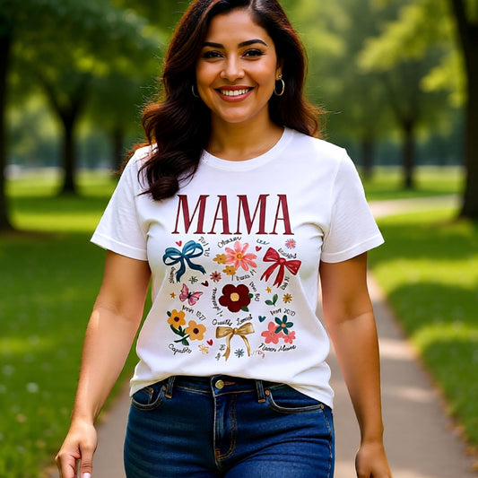 Model wearing a white Bella Canvas Mama t-shirt featuring floral illustrations and meaningful scripture-inspired words, perfect for Mother’s Day gifting.