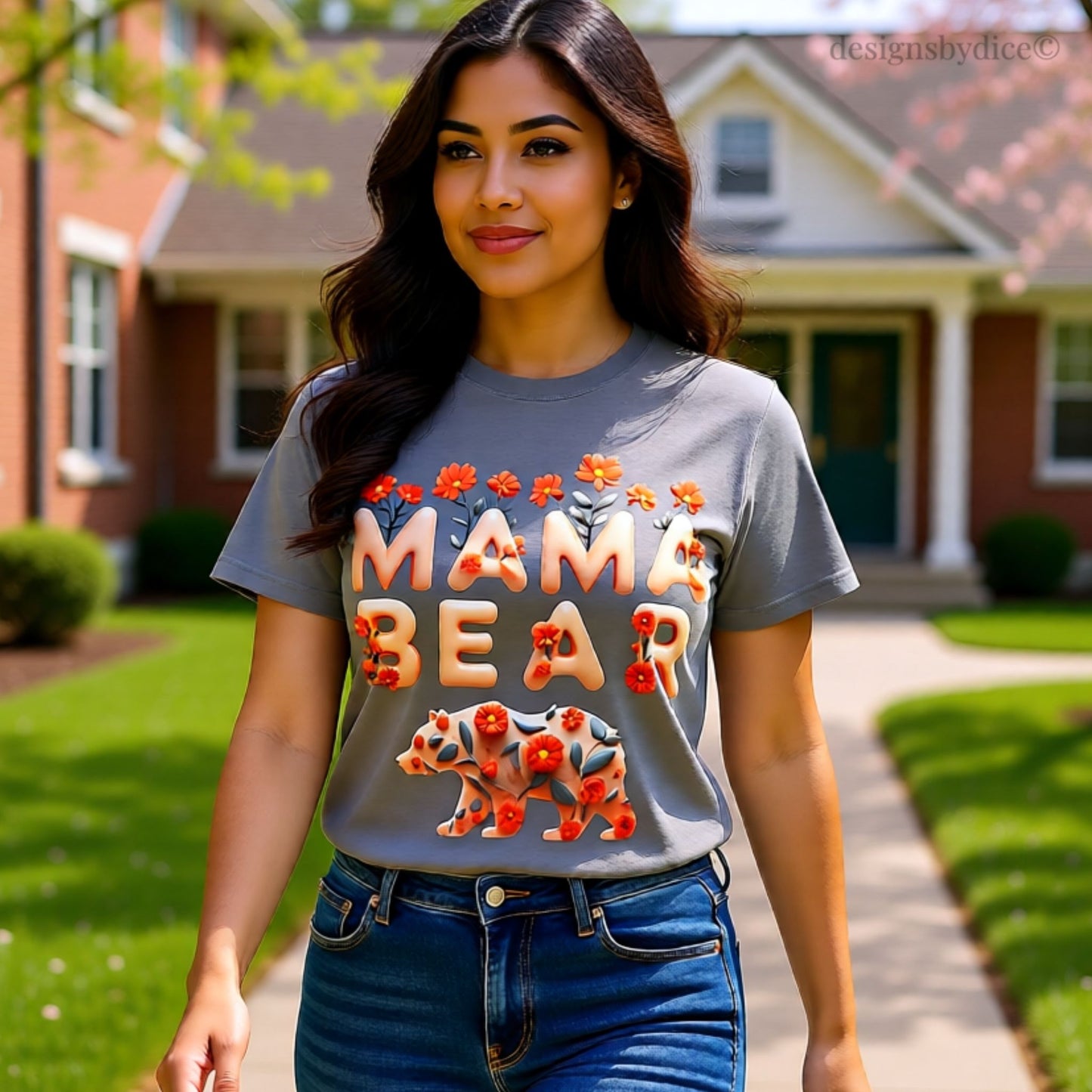 Woman wearing a 'Mama Bear' t-shirt in front of a house