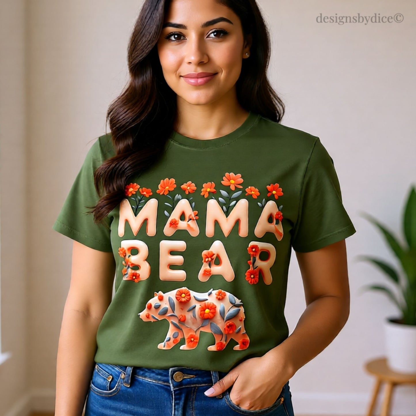 Woman wearing a green 'Mama Bear' t-shirt with floral designs indoors.